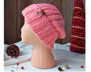 A hand knit wool beanie in solid pink features a stretchy, ribbed stitch pattern. Ideal for adults and teens, made from soft Turkish yarn.