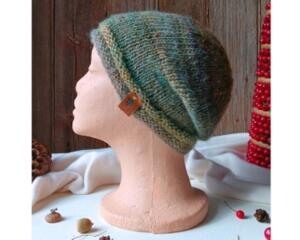 A hand knit acrylic & wool beanie in an ombre green and yellow cozy stitch pattern. For winter holiday gifting for kids ages 6, 7, 8, 9.