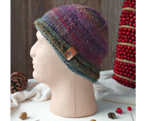 A hand knit acrylic & wool beanie in ombre red & blue. A winter holiday gift for children and preteens ages 10, 11, 12, 13, 14.
