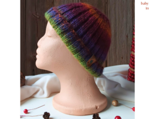 A babies & toddlers sized rainbow ombre hat knit with wool. Perfect for winter a gift for a baby or toddler ages 1, 2, 3, 4, 5 years old.