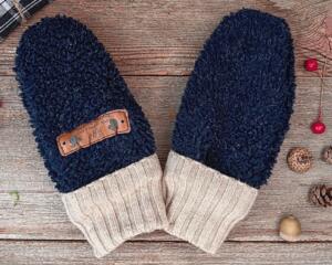 Handmade navy blue baby mittens with beige ribbed cuffs, made from soft boucle fleece; cozy thumbless winter mittens for infants & toddlers.