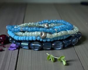 Beautiful handmade seedbead bracelets in shade of blue glass beads. This is a set of four bracelets for 20.00.