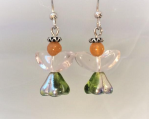 Green and silver skirt closeup of little angel earrings with crystal wings