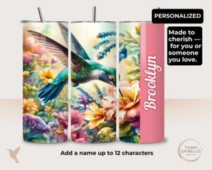 Personalized hummingbird tumbler with pink name panel and garden flowers, a meaningful 20oz gift for bird lovers and memorial occasions
