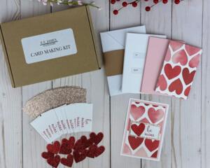 A valentine card making kit to create 12 of your own postcard style valentines with cardstock, paper, and embellishments.