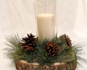 Handmade rustic wood slice candle centerpiece with pine greenery and pinecones, neutral farmhouse table decor for home, weddings, and events