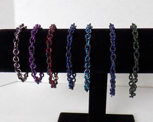 Rubber infinity stretch bracelets, handmade with epdm rubber and anodized aluminum by RainbowMaille in the USA