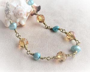 Wire wrapped bracelet topaz and aqua beads