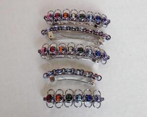 Rainbow chainmaille barrettes in Celtic bumble bee pattern made with anodized aluminum rings, handmade in the USA by RainbowMaille