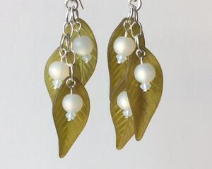 Mistletoe earrings with white lucite beads and green lucite leaves