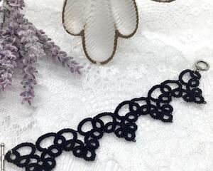 Black lace bracelet made with tatting method