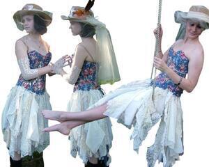 Blue flowered corset tattered dress.
Popper front and lace up back for snug fit. Pink flowers and white and cream tatters in the skirt.