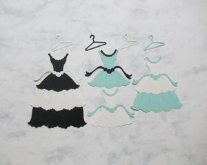 Fancy die cut dresses and hangers, green, black, and cream