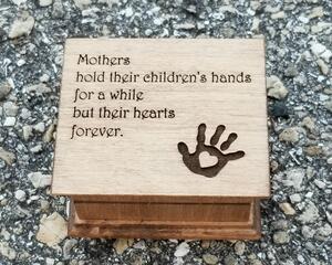 Music Box with Mothers hold their children's hands for a while but their hearts forever