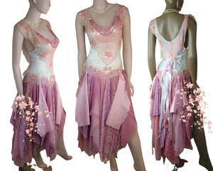 Pink and white with a touch of lavender. The bodice features vintage silk backed bling and  three ties at the back. This is a one of a kind, eco-friendly boho style wedding dress.