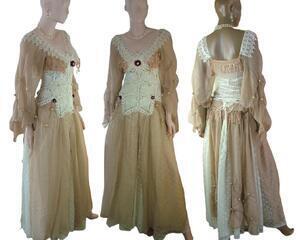 A tan and cream renaissance style long dress with a lace up back for a great fit and crochet bodice. Finished with fringe and red flowers here and there. One of a kind, hand made, eco-friendly bohemian style dress.