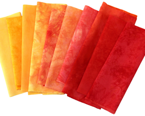 small cuts bundle of hand dyed quilting fabric in shades of red, orange and yellow