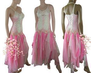 Pink and white tattered wedding dress with a lace up back and front for adjustable fit. It features batten burg lace and lots of lace in the skirt tatters. One of a kind, hand made, eco-friendly bohemian style dress.