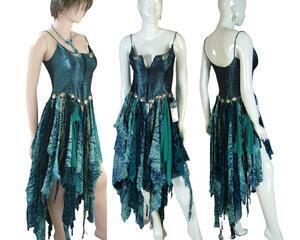 Blue corset dress with a steampunk taste to it. Metal around the low waistline and a zip up corset. Lots of blue tatters in the high low skirt. One of a kind, hand made, eco-friendly boho style dress.
