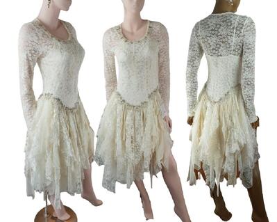 A pretty cream lace wedding dress finished with vintage gold bling around the hip line. Tattered skirt comprises of lots of lace and net fabric. One of a kind, handmade, eco-friendly, bohemian style clothes.