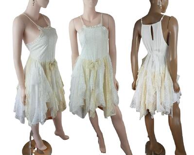 Knee length cream and white tattered dress.
Adjustable shoulder straps, very cute.