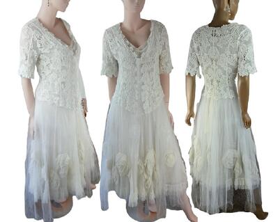 A pretty three layer wedding outfit. The long white dress features large roses in the skirt. A crochet style jacket with tulle attached to lay over the dress. The dress has a tie up back. One of a kind, hand made, eco-friendly bohemian style dress.
