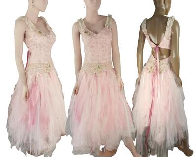 Pink tulle lace up dress with lots of bling and décor on the bodice. The skirt is full pink tulle.
One of a kind, handmade, eco-friendly, bohemian style clothes.