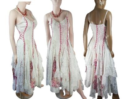 Pink, red and white tattered hippy style dress. Side laces for snug fit and lots of lace and net fabric tatters in the full length skirt. One of a kind, handmade, eco-friendly, bohemian style clothes.