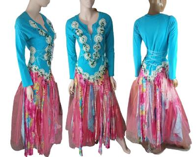 A colorful hippy style dress, a multi colored tattered skirt. The bodice features crochet and beads and has a lace up back with adjustable ties at the sides for a perfect fit. One of a kind, hand made, eco-friendly bohemian style dress.