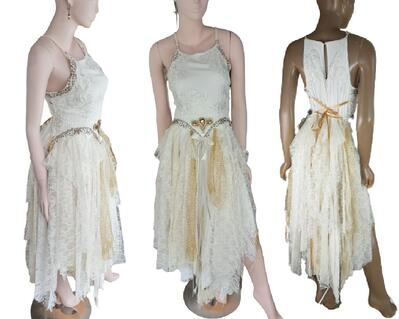 Three views of a long white tattered dress.  Spaghetti straps and a lace up back.   Gold décor around the hip line. One of a kind, hand made, eco-friendly, bohemian style event dress.