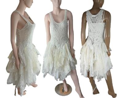 Vintage inspired flapper style tattered dress in cream. Mid calf with slight high low skirt. See through bodice with no sleeves will require an undergarment. One of a kind, eco-friendly dress.