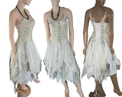 White and green woodland style tattered wedding dress. Mid calf length and feature vintage bling on the bodice and the back allows a lace up for a snug fit. One of a kind, hand make, eco-friendly boho style dress.
