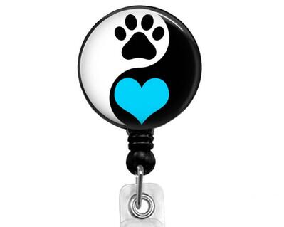 Paw print with blue heart on black reel