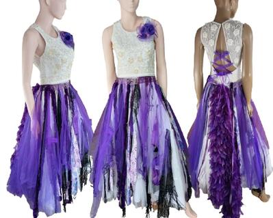 Purple and white reworked wedding dress. Lots of tulle and colors in the skirt with a lace up back and wedding bling on the bodice. One of a kind dress.