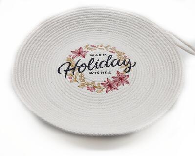 A warmly machine embroidered handmade rope bowl with a holiday saying, "Warm Holiday Wishes."

A white (not a bright white) large handmade bowl made with cotton rope. The rope is coiled and sewn into place to form this decorative, but functional bowl.  The design is stitched directly on the bottom of the coiled bowl on my home embroidery machine. The colors I used are a cranberry, medium gold and black.   It measures 11 inches across and 2 inches deep.    It has a machine sewn loop handle.

Use it to  hold your most used items, keys, eye glasses, sewing and crafting supplies, office supplies, pine cone or fresh fruit.

Clean by wiping the surface with a warm damp towel.  I do not recommend placing it in the washing machine.

Not for use as a casserole holder.