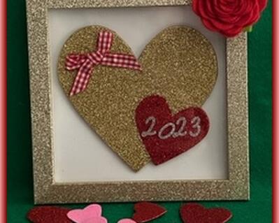 This is one of two items with everything the same EXCEPT the red heart and plaid bow are on different sites of the total placement.  Measures 4" x 4" with glitter hammered frame with large gold heart and small red heart with this years date in silver glitter numbers.