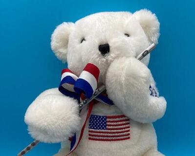 10" tall Patriotic flutist white bear.  red,white, and blue bow tie and Starts and Stripe on chest wall.  This is a very well made bear and is sturdy and adorable.  One of a kind with this bear.