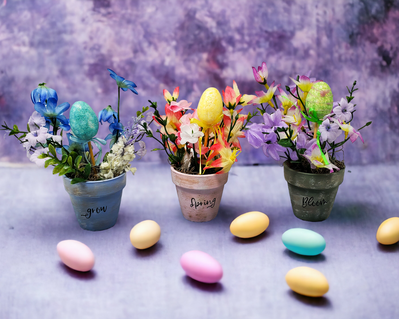 Miniature Easter floral arrangements for a tiered tray in an Easter scene.