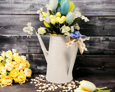Pitcher full of blue and yellow spring tulips