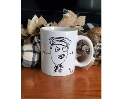 Coffee mug with funny kids stick figure artwork.