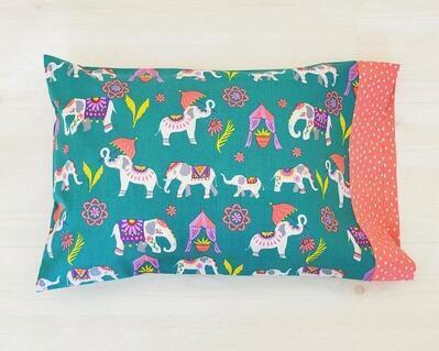 Organic cotton handmade pillowcase on jeweled toned fabric featuring elephants
