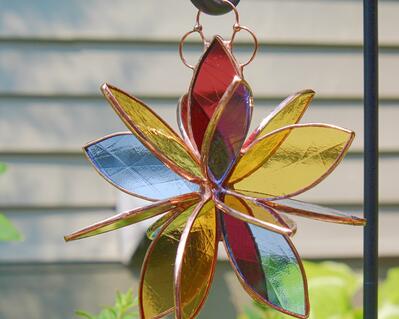 Products :: 3D stained glass spinner. Twirling rainbow colors with bevels.  Hanging beveled prism sun catcher for inside outside. Expertly handcrafted  home decor