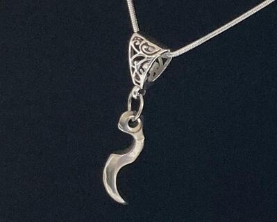 An abstract trill lever made in sterling silver is  a unique unisex necklace.  It is on a 16" snake chain and  antique style bail.  This is truly a special gift for male or female flutists.  We used a lovely bail attached to a silver plated necklace.