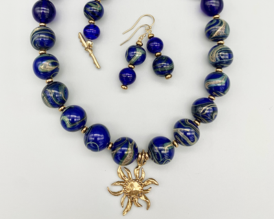 Necklace set | Cobalt blue swirled vintage glass rounds, artisan bronze sunflower pendant