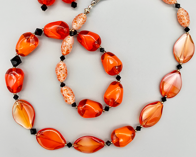 Necklace set | Orange/white givre nuggets, seed-shaped vintage glass beads, speckled irregular ovals, jet crystals