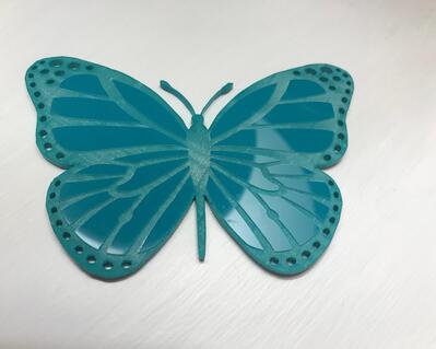 Teal acrylic butterfly laser engraved and cut