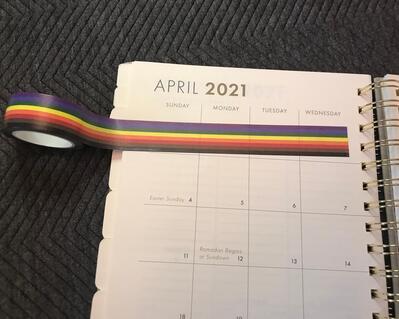 People of color pride tape on journal