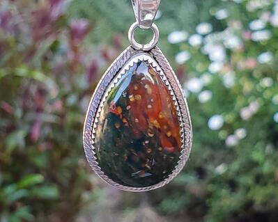 Bloodstone pendant with fern cutout