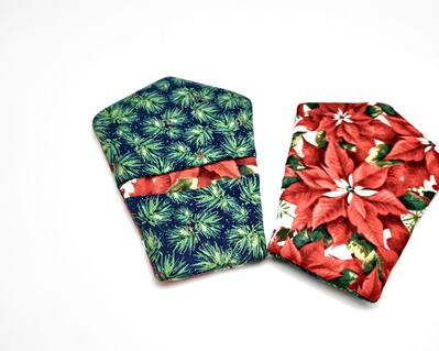 Finger Mini Mitts.
Protect your fingers in the kitchen with these super handy and colorful fingertip oven mitts.  Great for grabbing hot handles and lids on casserole dishes and cooking pans.

    What you get: One pair of insulated finger pocket mini mitts.
    Fabric color:   Red Poinsettias on a neutral background.  Reverse is green pine boughs with red holly berries.
    Fabric used:  two layers of 100% cotton fabric, lined with one layer of heat resistant batting and one layer of cotton batting-all preshrunk.
    Size:  7 1/4 inches x 5 inches - fits snuggly to stay in place on your hand.
    Care:  Hand - or machine-wash in cold water with like colors, air dry. No bleach.
    Listing is for 1 pr. of oven mitts only.  Casserole dish and spoon are not included.

NOTE:  These are heat resistant, NOT heat proof.  Hot pads are for oven or stove top use only, they are NOT for use in the microwave except to remove hot items from it.  Do not leave pot holder in microwave oven while the oven is operating - that will damage your microwave.