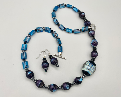Necklace set | Contemporary artisan lampwork focal bead, palette of blue vintage glass beads, jet crystal, hematine
